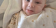 Victoria participe au concours pour gagner de l'argent avec cette photo : baby, smiling, face, tongue, blanket, stars, cozy, infant, cute, child, closeup, soft, warm, wrapped, happy, expression, newborn, person, indoors, comfort