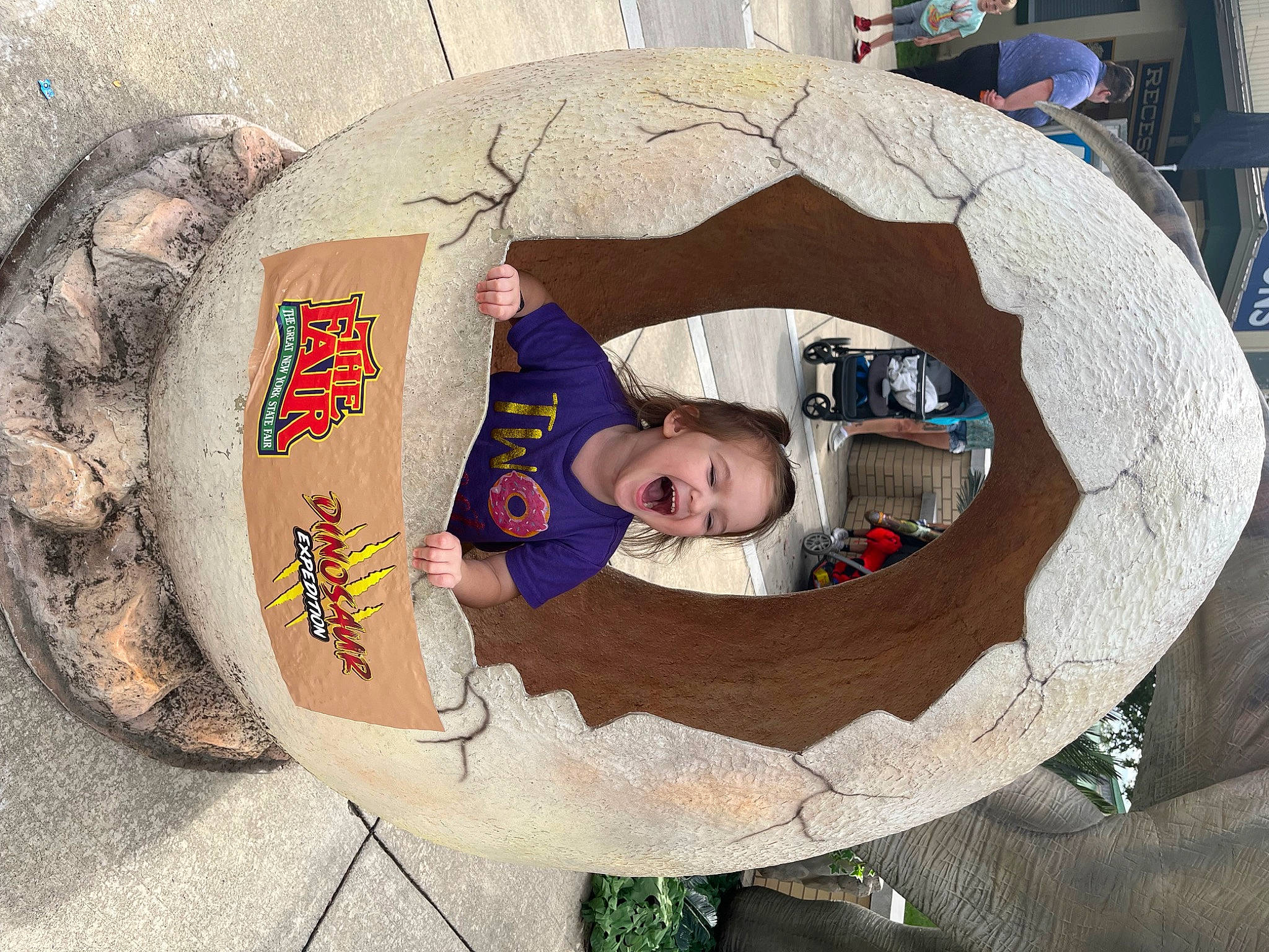 Adrian is registered to the contest to win money with this photo: baby, child, circle, comfort, concrete, fun, hat, leisure, person, toddler, tree, wood