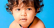 Phelopateer is registered to the contest to win money with this photo: baby, blue_background, casual, child, childhood, clothing, curly_hair, cute, expression, face, hair, head, indoor, looking_at_camera, person, pink_tie, portrait, skin, toddler, young_child