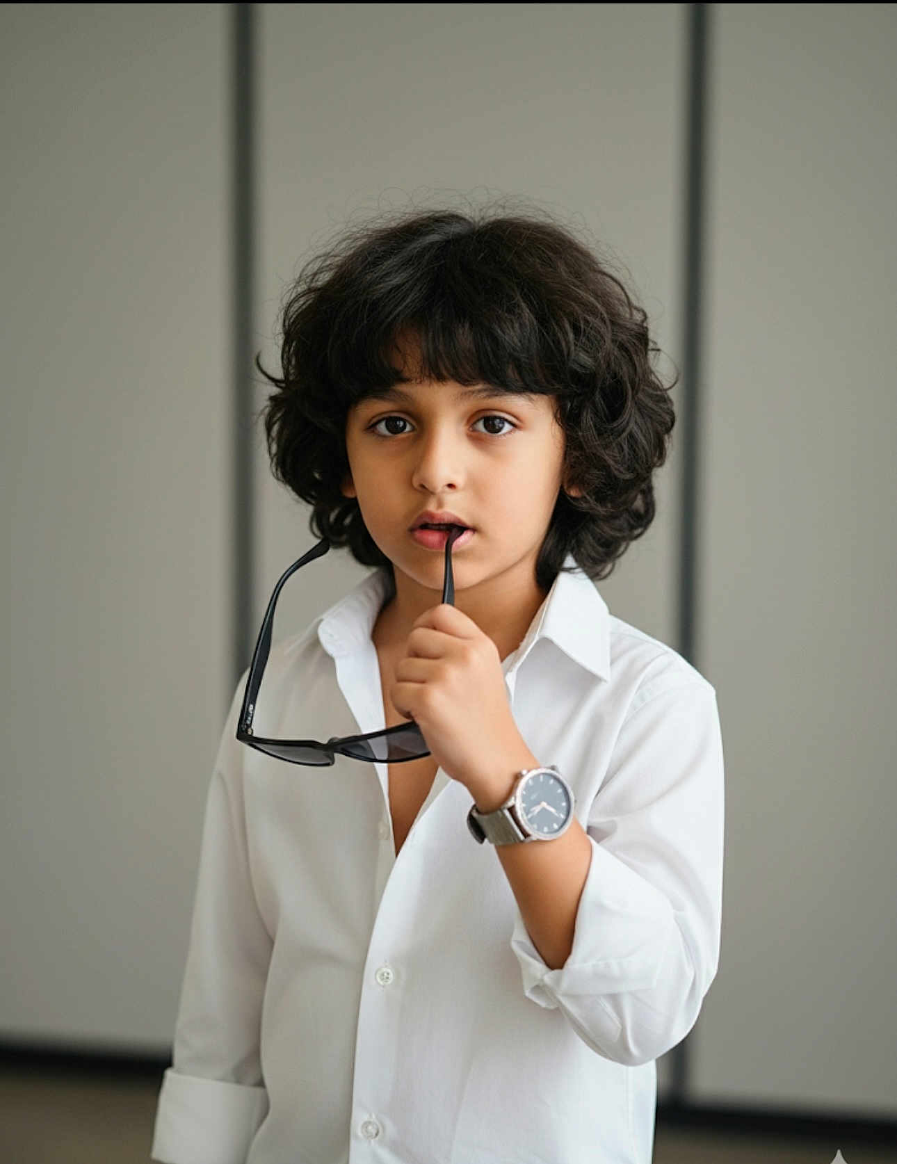 Christiano joined the competition — help win amazing prizes! accessory, casual, child, contemplative, curly_hair, expression, eyes, face, fashion, hair, hand, indoor, minimalist, person, portrait, style, sunglasses, watch, white_shirt, young