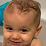 Mathéo participe au concours pour gagner de l'argent avec cette photo : baby, infant, toddler, bath, bathtub, wet_skin, close_up, smile, eyes, curly_hair, face, cheek, ear, nose, mouth, toy, blue_plastic, water_droplet, portrait, happy_expression