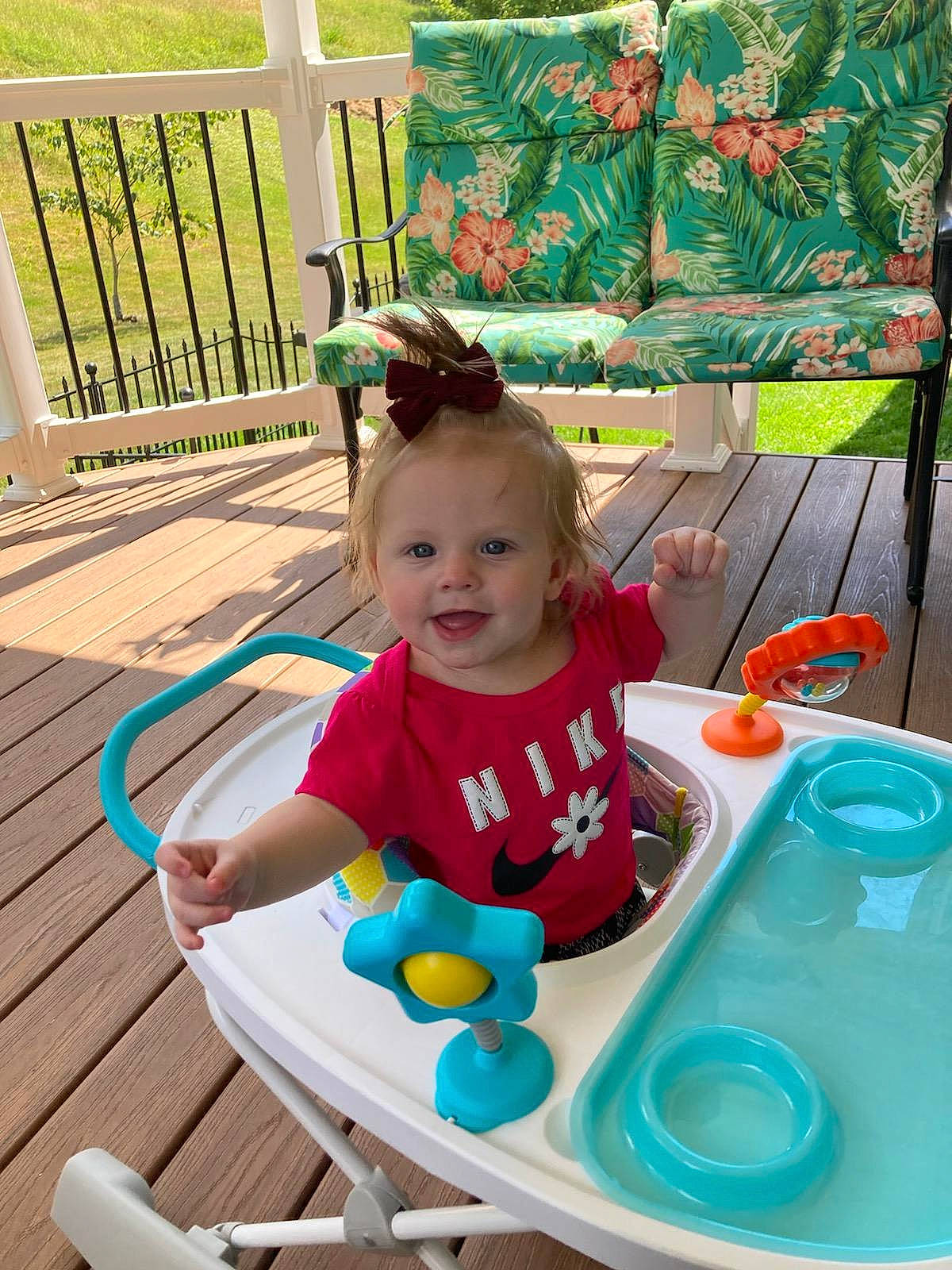 Rosalyn is registered to the contest to win money with this photo: baby, baby_playing_with_toys, baby_toddler_clothing, chair, child, fun, furniture, grass, green, happy, leisure, outdoor_furniture, person, sitting, smile, summer, t_shirt, table, toddler, toy