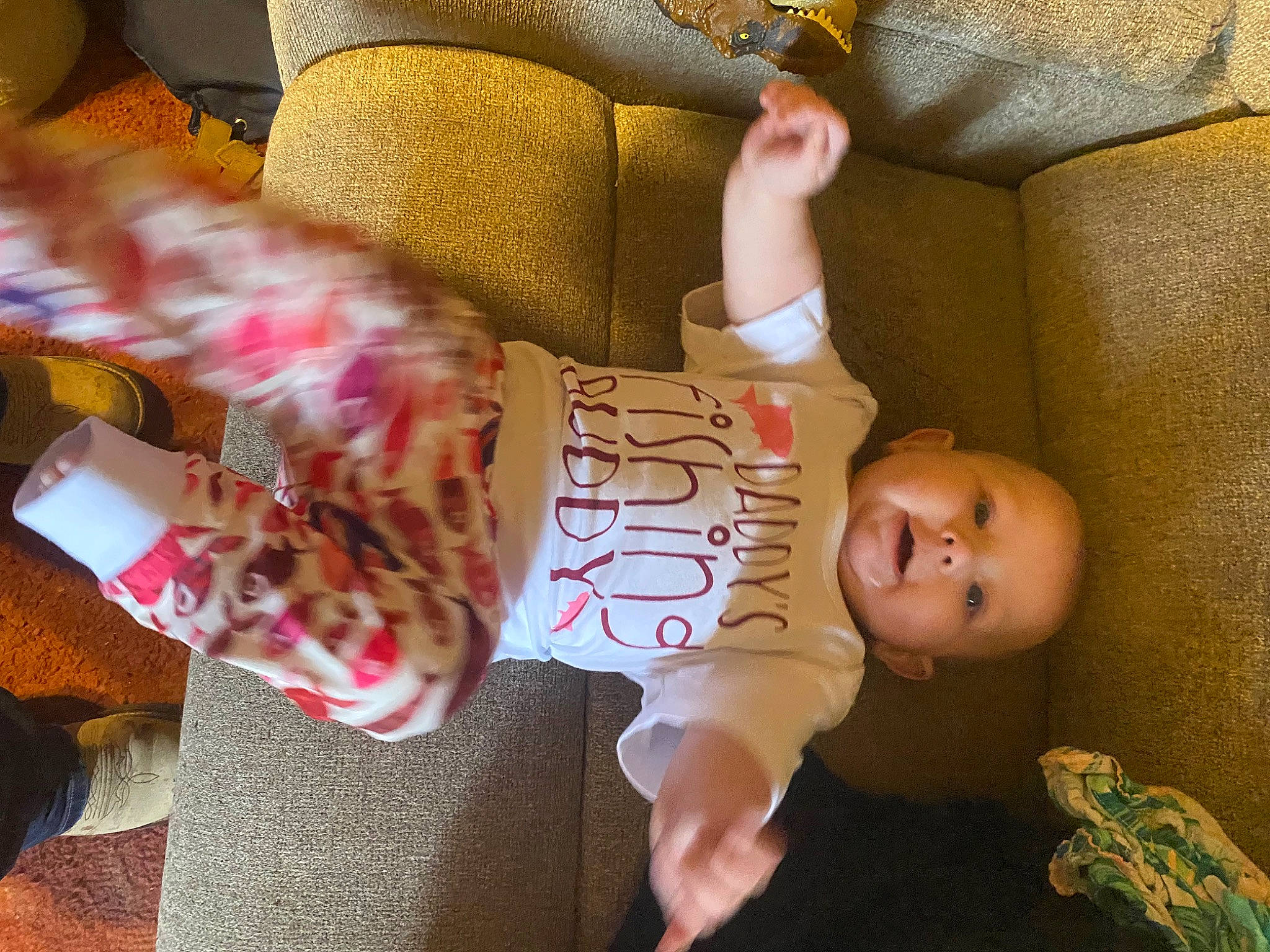 Scarlett joined the competition — help win amazing prizes! arm, baby, baby_toddler_clothing, child, comfort, couch, fun, happy, head, human_body, human_leg, linens, pattern, person, room, sitting, skin, smile, thigh, toddler