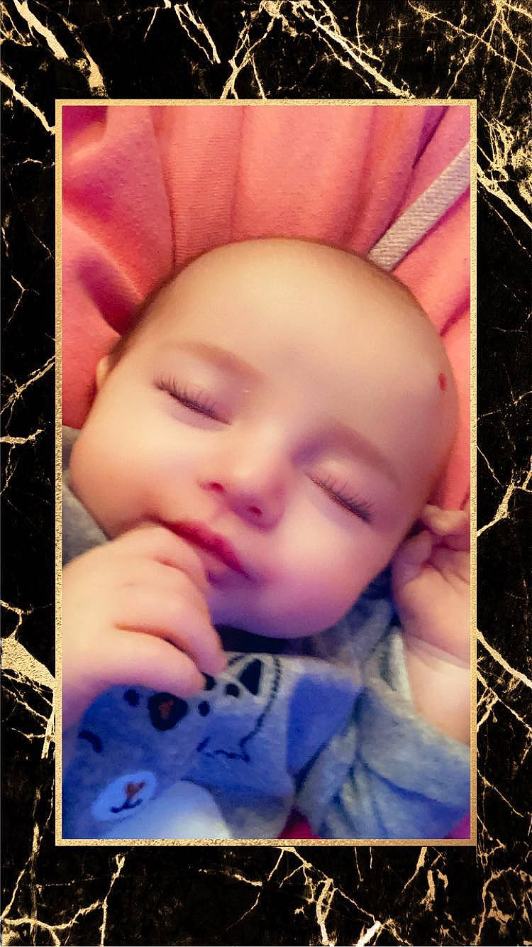 Arieannna is registered to the contest to win money with this photo: baby, baby_toddler_clothing, cheek, child, chin, eyelash, grass, happy, iris, lip, mouth, nose, pattern, people_in_nature, person, pink, purple, skin, smile, textile