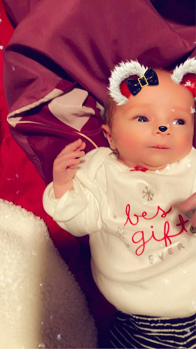 Arieanna is registered to the contest to win money with this photo: baby, baby_toddler_clothing, cap, cheek, costume_hat, doll, eyebrow, eyelash, fictional_character, fur, happy, headband, headpiece, human_body, jewellery, lip, ornament, person, pink, sleeve