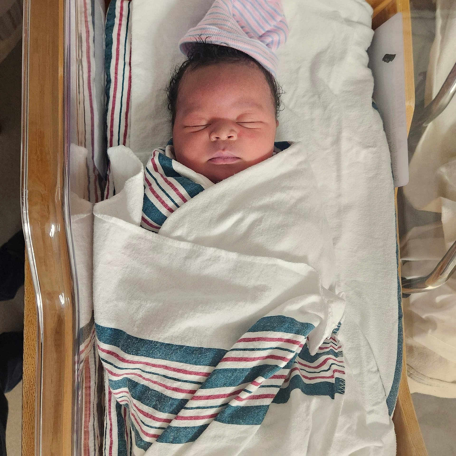 David joined the competition — help win amazing prizes! newborn, baby, swaddled, blanket, hospital, bassinet, sleeping, infant, cap, face, peaceful, wrapped, bed, person, child, cute, soft, resting, healthcare, newborncare
