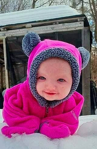 Lilyana joined the competition — help win amazing prizes! baby, cap, cheek, face, freezing, fun, happy, headgear, headwear, jacket, knit_cap, leisure, magenta, person, pink, purple, recreation, smile, snow, toddler