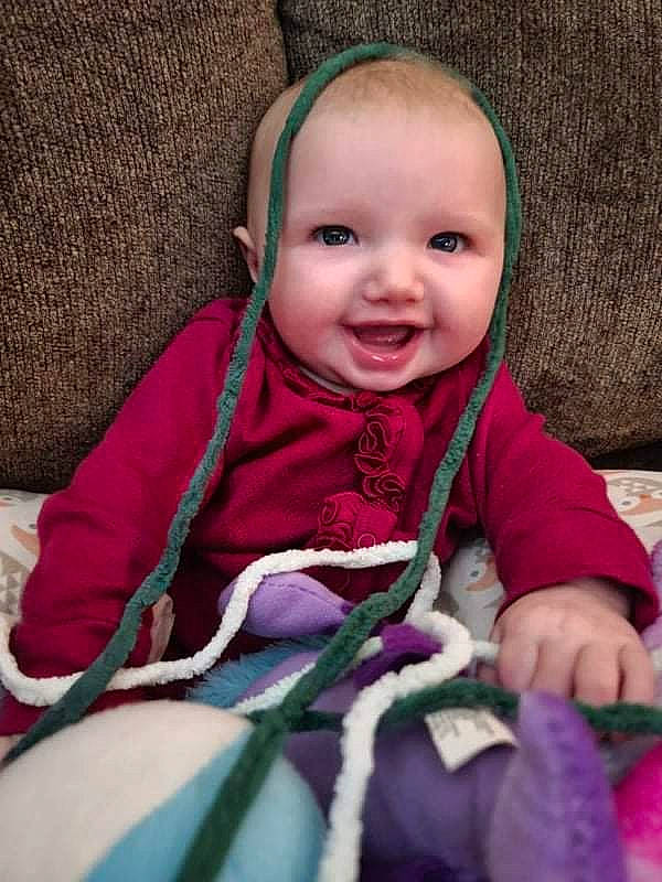 Lilyana joined the competition — help win amazing prizes! baby, baby_toddler_clothing, cheek, comfort, eye, face, facial_expression, happy, human_body, iris, mammal, nose, outerwear, person, pink, product, purple, skin, sleeve, smile