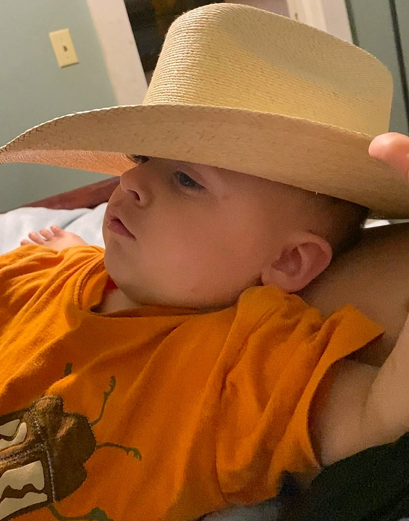 Sylas joined the competition — help win amazing prizes! arm, baby, cap, chin, comfort, eye, eyebrow, eyelash, face, hat, head, headwear, human_body, lip, mouth, nose, orange, person, skin, sleeve