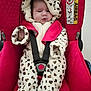 baby, infant, car_seat, red, clothing, onesie, animal_print, hood, face, child, seatbelt, safety, cute, indoor, portrait, young_child, baby_clothes, seat, baby_boy, baby_girl
