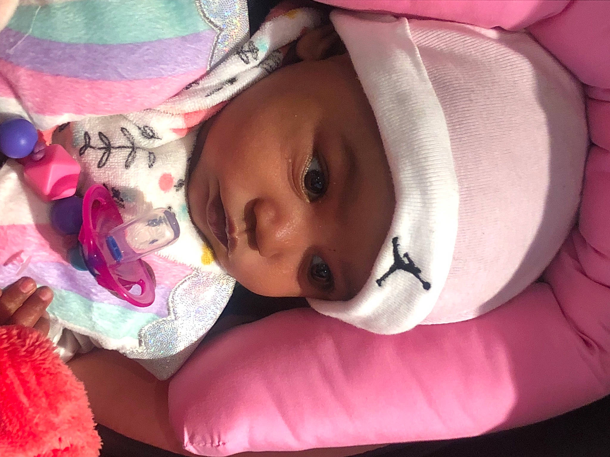 Malià is registered to the contest to win money with this photo: baby, baby_toddler_clothing, cheek, comfort, eye, eyebrow, eyelash, face, facial_expression, headwear, human, iris, lip, mammal, mouth, nose, organ, person, pink, purple