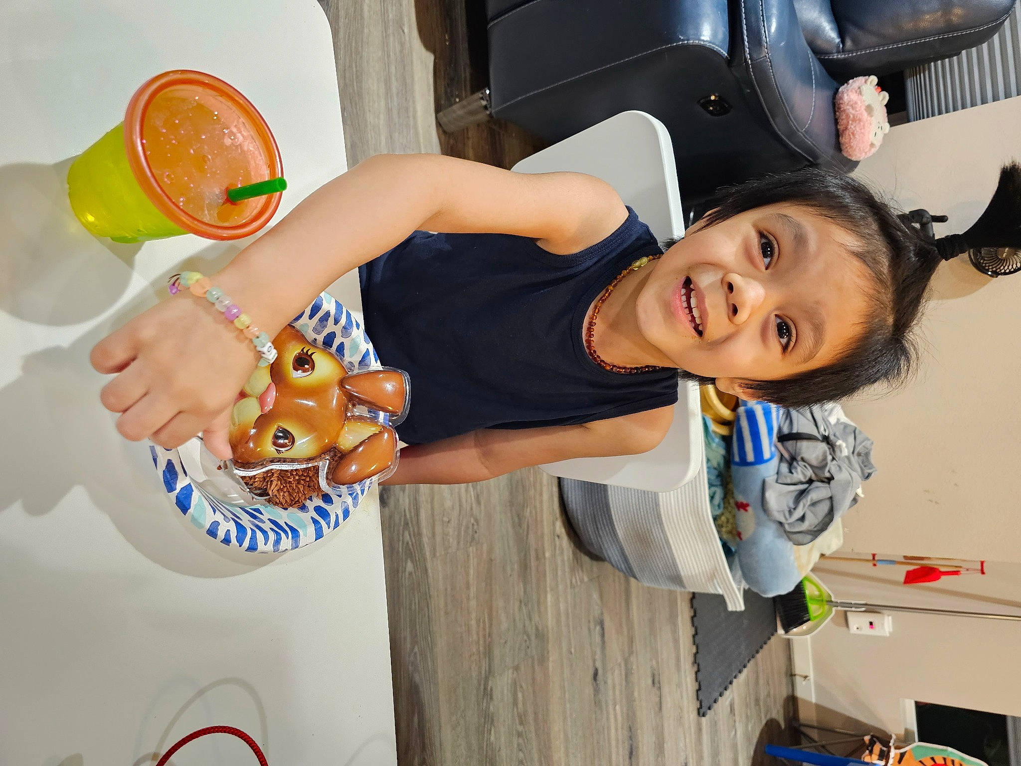 Leo is registered to the contest to win money with this photo: automotive_exterior, automotive_tire, child, family_car, fun, happy, human_leg, joy, leisure, motor_vehicle, nail, party_supply, person, room, smile, t_shirt, tableware, thigh, toddler, vacation