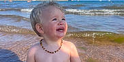 Kayson joined the competition — help win amazing prizes! accessories, baby, beach, boat, coast, face, happy, head, jewelry, nature, necklace, outdoors, person, photography, portrait, sea, shoreline, summer, transportation, water