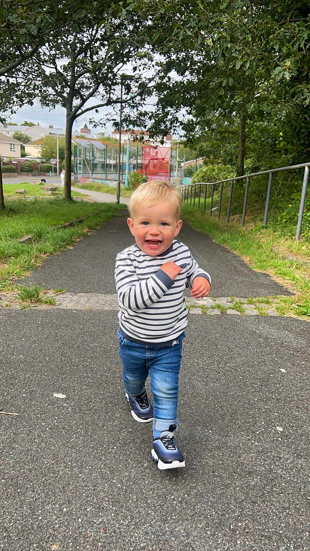 Kayson is registered to the contest to win money with this photo: city, clothing, face, grass, head, jeans, nature, outdoors, pants, park, path, person, photography, plant, portrait, road, street, urban, vegetation, walking