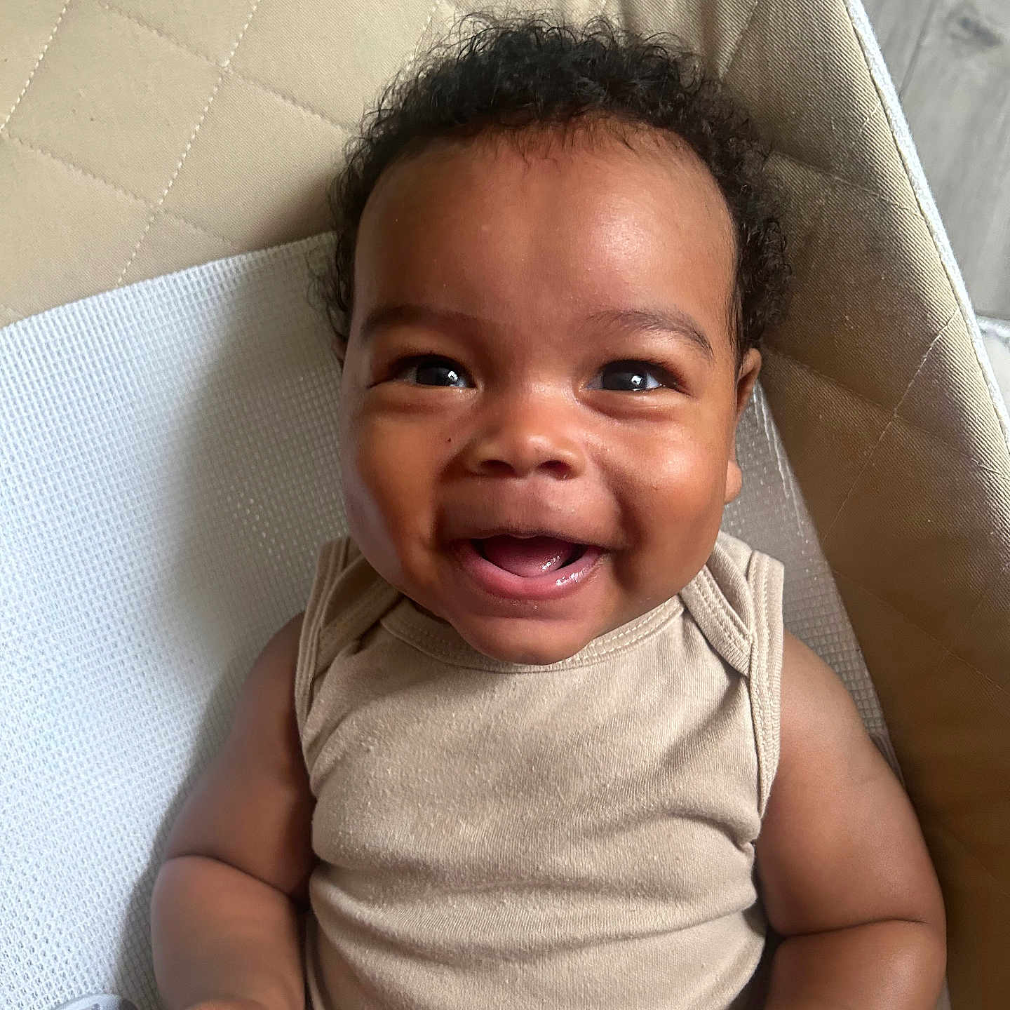 Jalen joined the competition — help win amazing prizes! baby, beige, child, clothing, curly_hair, cushion, cute, expression, face, furniture, hand, happy, indoors, infant, person, portrait, sitting, skin, smiling, young