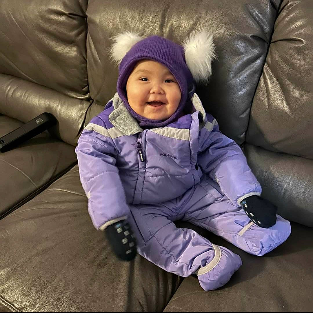 Avery joined the competition — help win amazing prizes! baby, baby_toddler_clothing, cap, child, comfort, couch, electric_blue, flooring, fun, happy, headwear, joy, lap, magenta, person, plant, purple, sitting, sleeve, smile