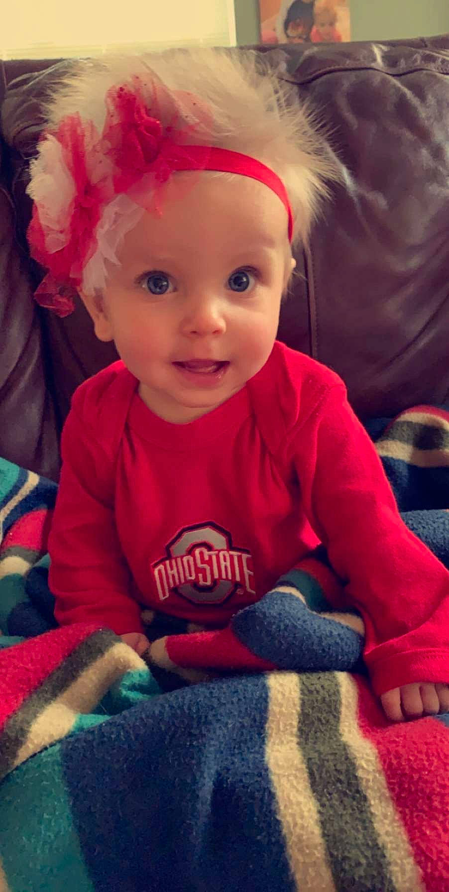 Margaret is registered to the contest to win money with this photo: baby, cheek, child, eye, face, head, iris, lip, nose, person, play, sitting, skin, smile, toddler