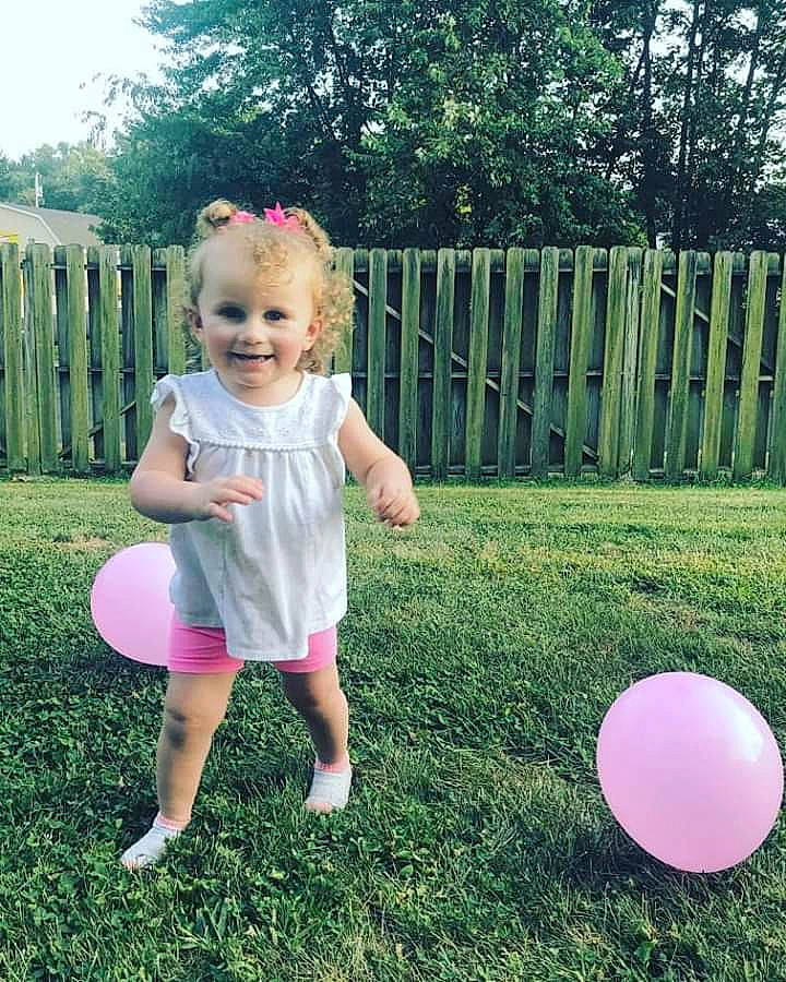 Kynzleigh is registered to the contest to win money with this photo: backyard, ball, child, dress, fun, grass, joy, lawn, person, pink, plant, play, playground, summer, toddler, tree, yard