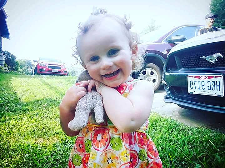Kynzleigh is registered to the contest to win money with this photo: baby, beauty, car, child, cool, eye, face, facial_expression, grass, happy, head, headwear, joy, leaf, people, person, product, skin, sky, smile