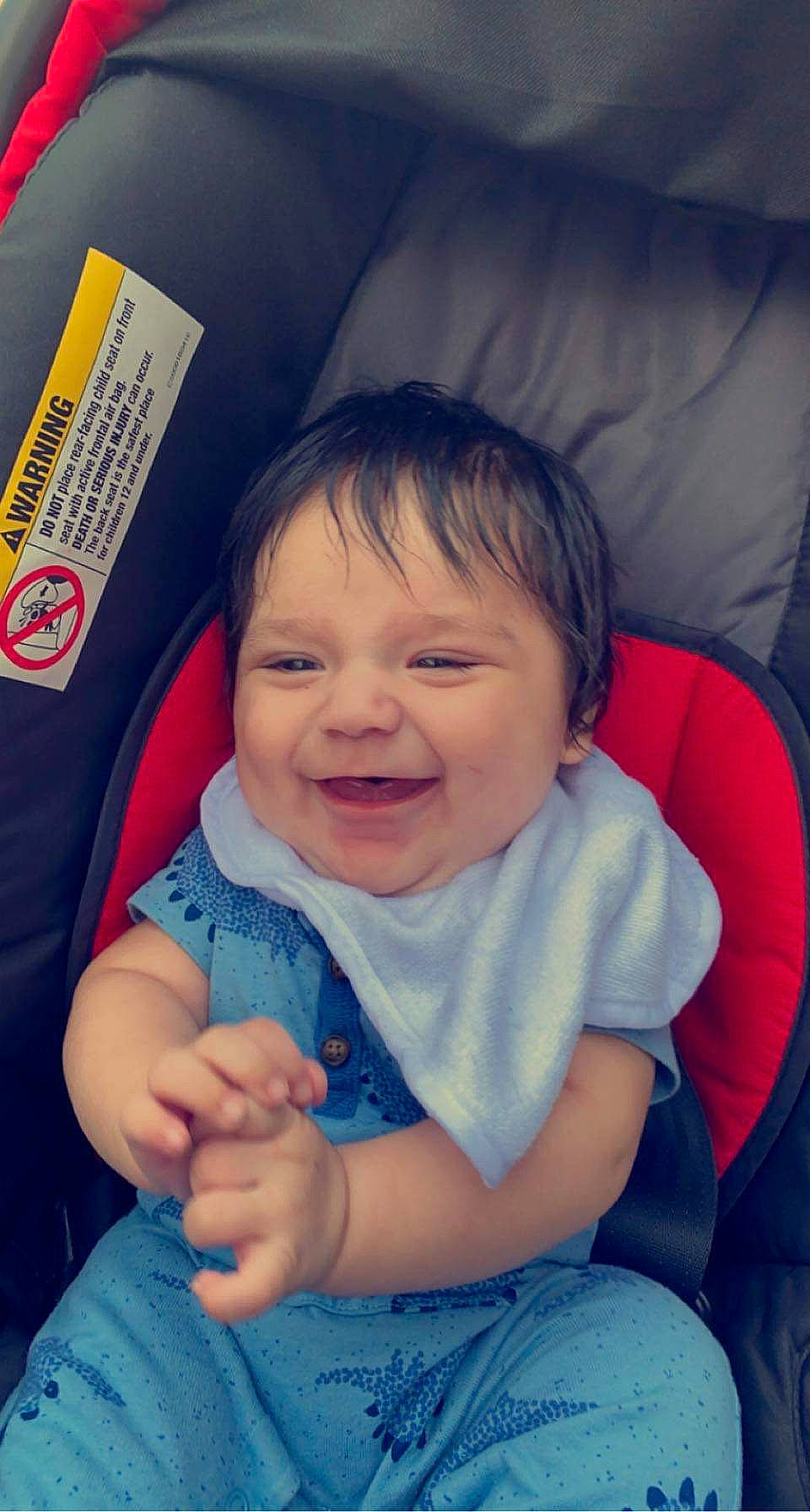 Isaiah is registered to the contest to win money with this photo: azure, baby_toddler_clothing, blue, cheek, chin, clothing, comfort, eye, eyebrow, facial_expression, hand, happy, iris, joy, lip, mouth, nose, organ, person, product