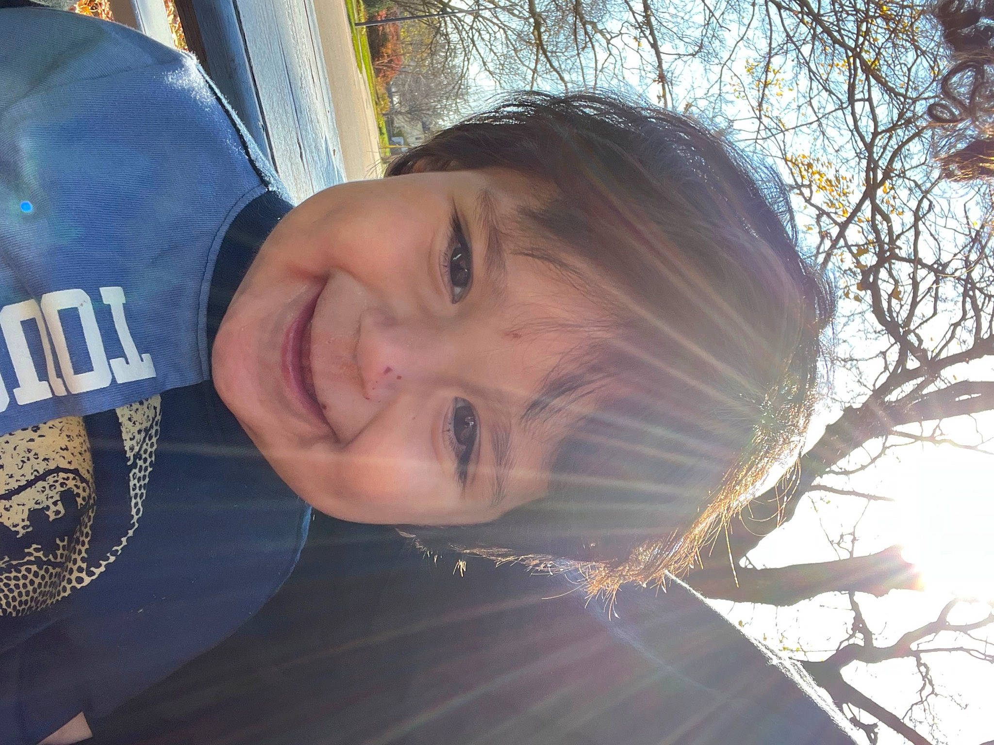 Isaiah is registered to the contest to win money with this photo: baseball_cap, cap, child, chin, electric_blue, flash_photography, fun, grass, happy, hat, joy, leisure, nose, person, personal_protective_equipment, plant, selfie, sky, smile, toddler