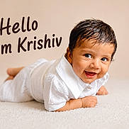 Krishiv is registered to the contest to win money with this photo: baby, child, infant, smiling, white_clothing, lying_down, face, eyes, hair, skin, cute, portrait, indoor, carpet, expression, happy, young, person, text_overlay, greeting