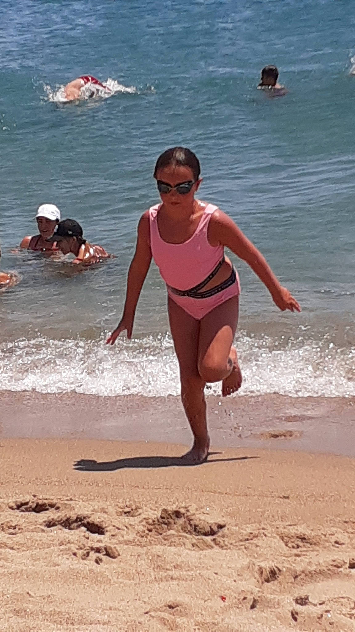 Orlane participe au concours pour gagner de l'argent avec cette photo : barechested, barefoot, beach, brassiere, chest, fun, happy, headgear, headwear, human_body, leisure, one_piece_swimsuit, people_on_beach, person, summer, swimwear, thigh, undergarment, underpants, waist