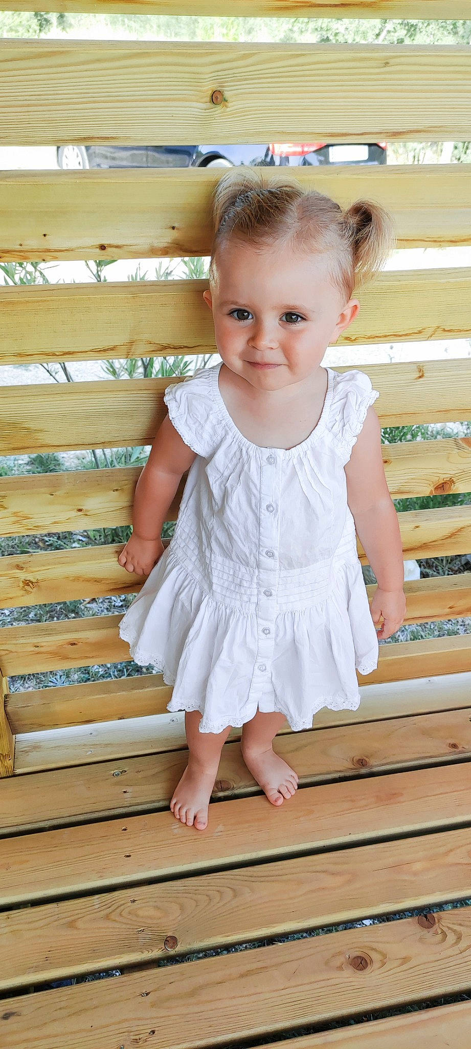 Lexy participe au concours pour gagner de l'argent avec cette photo : arm, baby, baby_toddler_clothing, clothing, day_dress, dress, eye, floor, happy, joint, joy, one_piece_garment, pattern, person, shoulder, sleeve, smile, stairs, standing, toddler