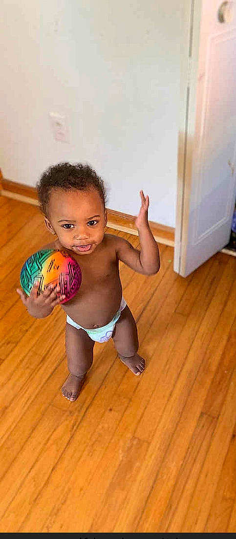 Damauri joined the competition — help win amazing prizes! baby, ball, child, diaper, floor, flooring, leg, person, play, standing, toddler, wood