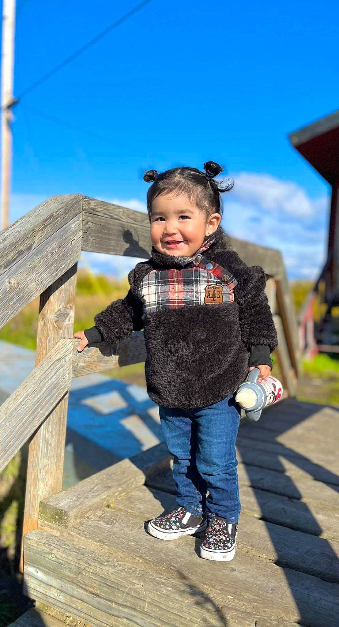 Indy is registered to the contest to win money with this photo: child, city, clothing, cloud, denim, electric_blue, fun, grass, happy, jacket, jeans, joy, leisure, pattern, person, public_space, recreation, sky, smile, sneakers