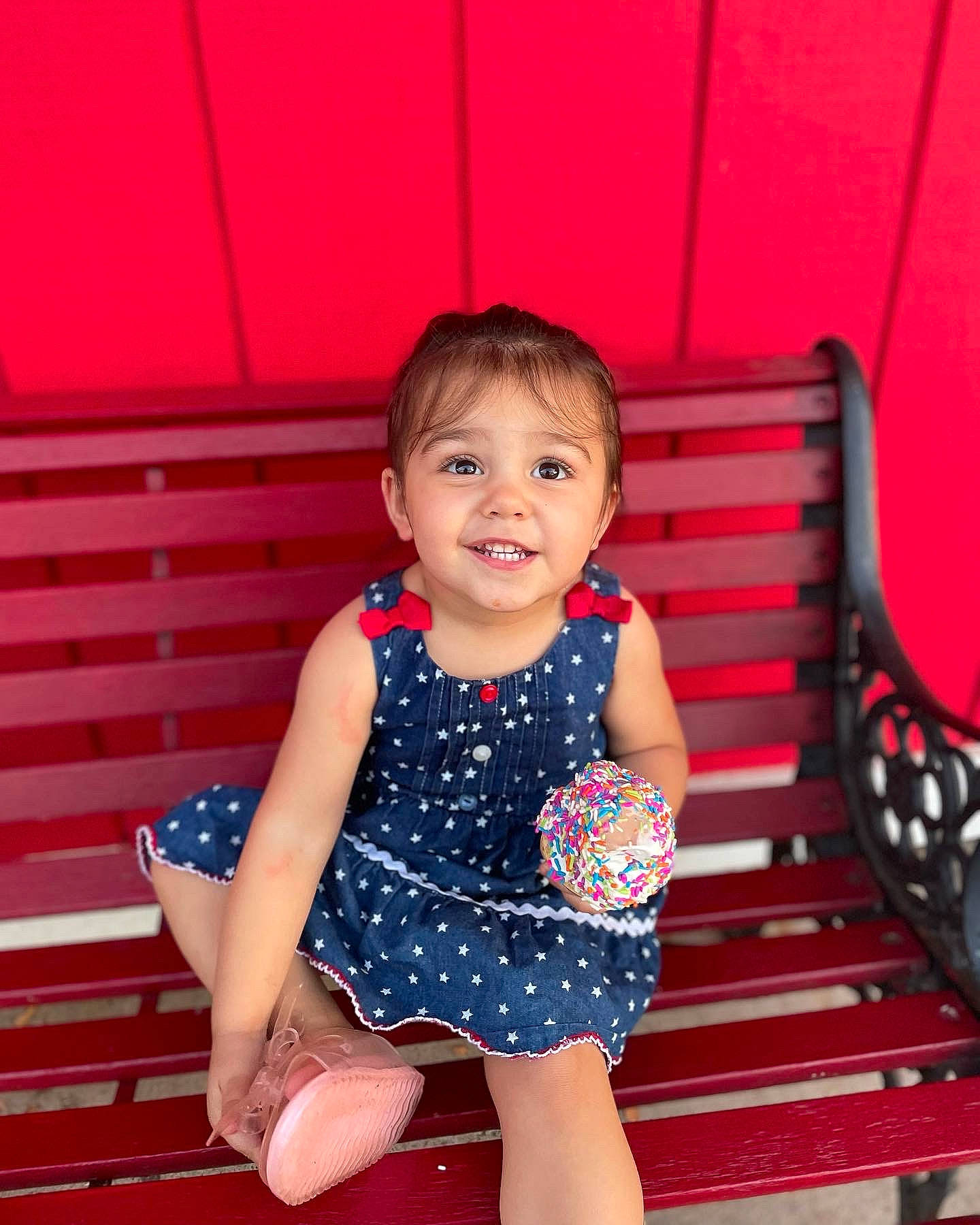 Addie is registered to the contest to win money with this photo: baby_toddler_clothing, beauty, child, dress, eye, finger, flash_photography, hair, happy, head, human_body, joy, neck, one_piece_garment, person, pink, red, skin, sleeve, smile