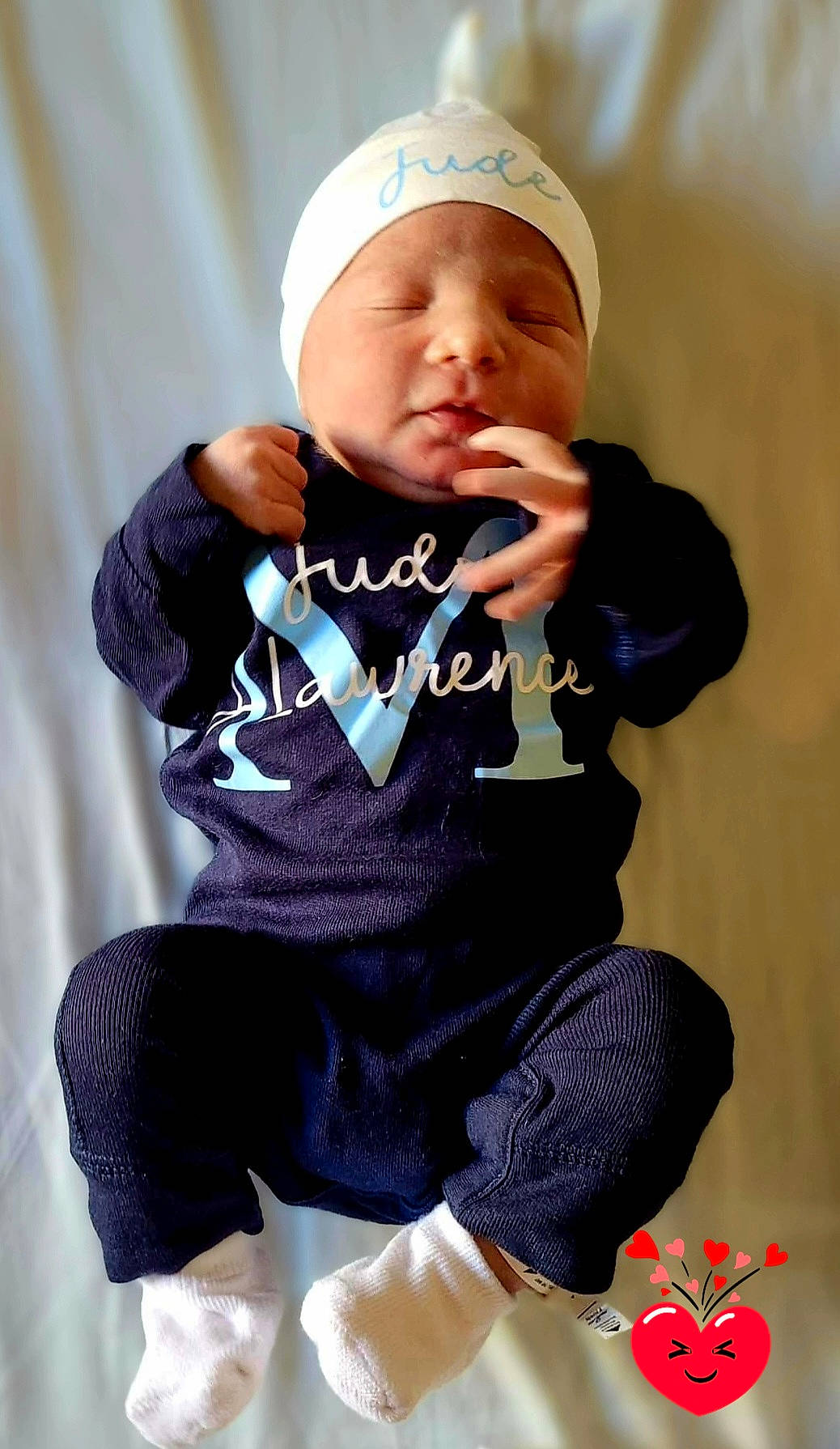 Jude joined the competition — help win amazing prizes! baby, baby_products, baby_toddler_clothing, beanie, cap, child, comfort, electric_blue, face, happy, hat, headgear, headwear, pattern, person, personal_protective_equipment, purple, sitting, sleeve, sock