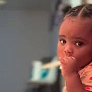 Lay Lay joined the competition — help win amazing prizes! toddler, child, indoors, floor, pajamas, braided_hair, thumb_sucking, curious, young_child, person, home, cozy, seated, expression, casual_clothing, infant, baby, portrait, cute, looking
