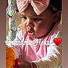 Lay Lay joined the competition — help win amazing prizes! baby_girl, pink_bow, curly_hair, toy, pink_clothing, white_clothing, bracelet, focused, indoor, child, playing, cute, infant, music_overlay, text_overlay, heart_emoji, closeup, portrait, young_child, soft_lighting