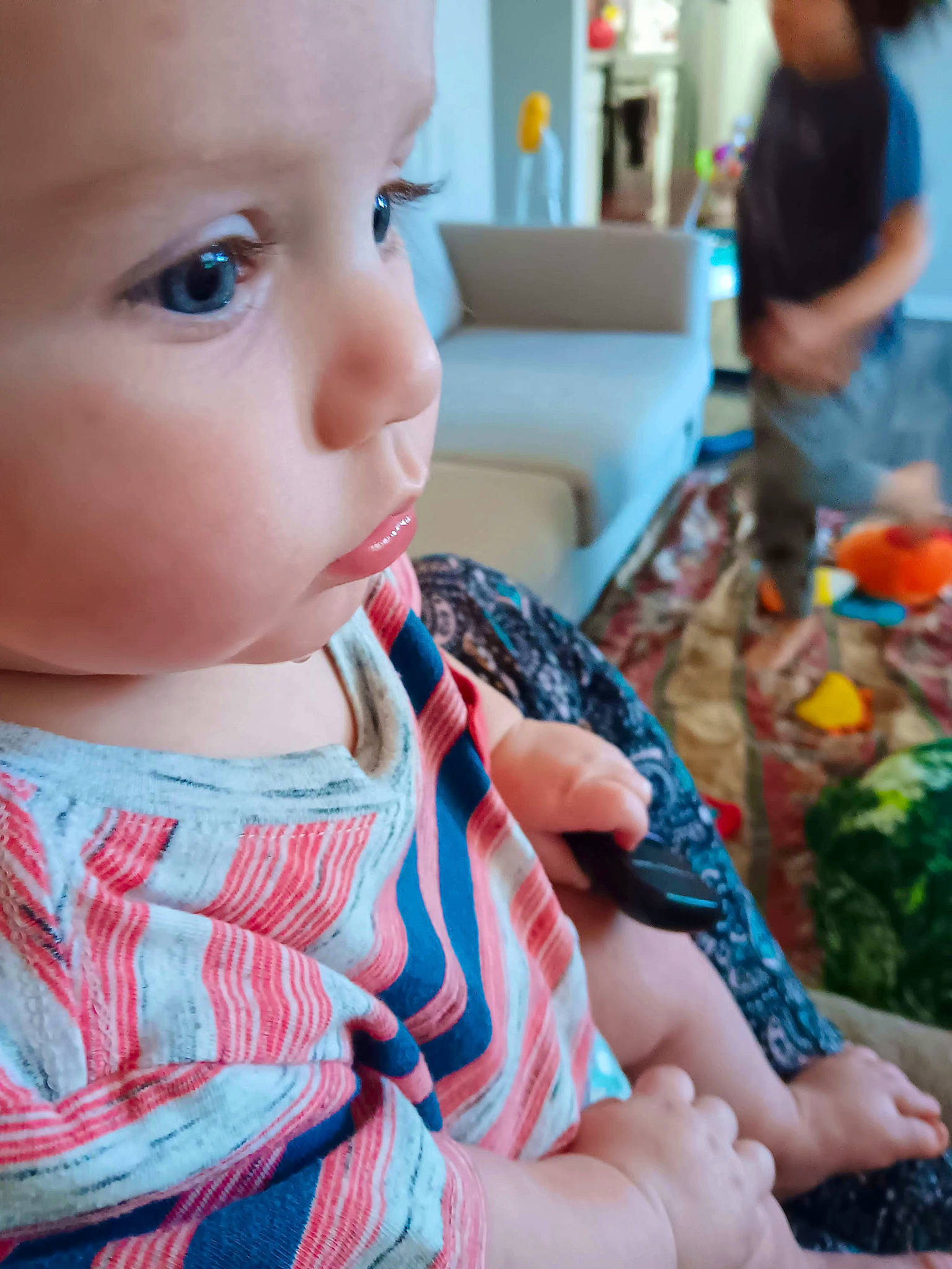 Sasha is registered to the contest to win money with this photo: baby, baby_toddler_clothing, cheek, child, eye, eyelash, finger, fun, happy, head, headwear, iris, lip, mouth, nose, person, sitting, skin, sleeve, t_shirt