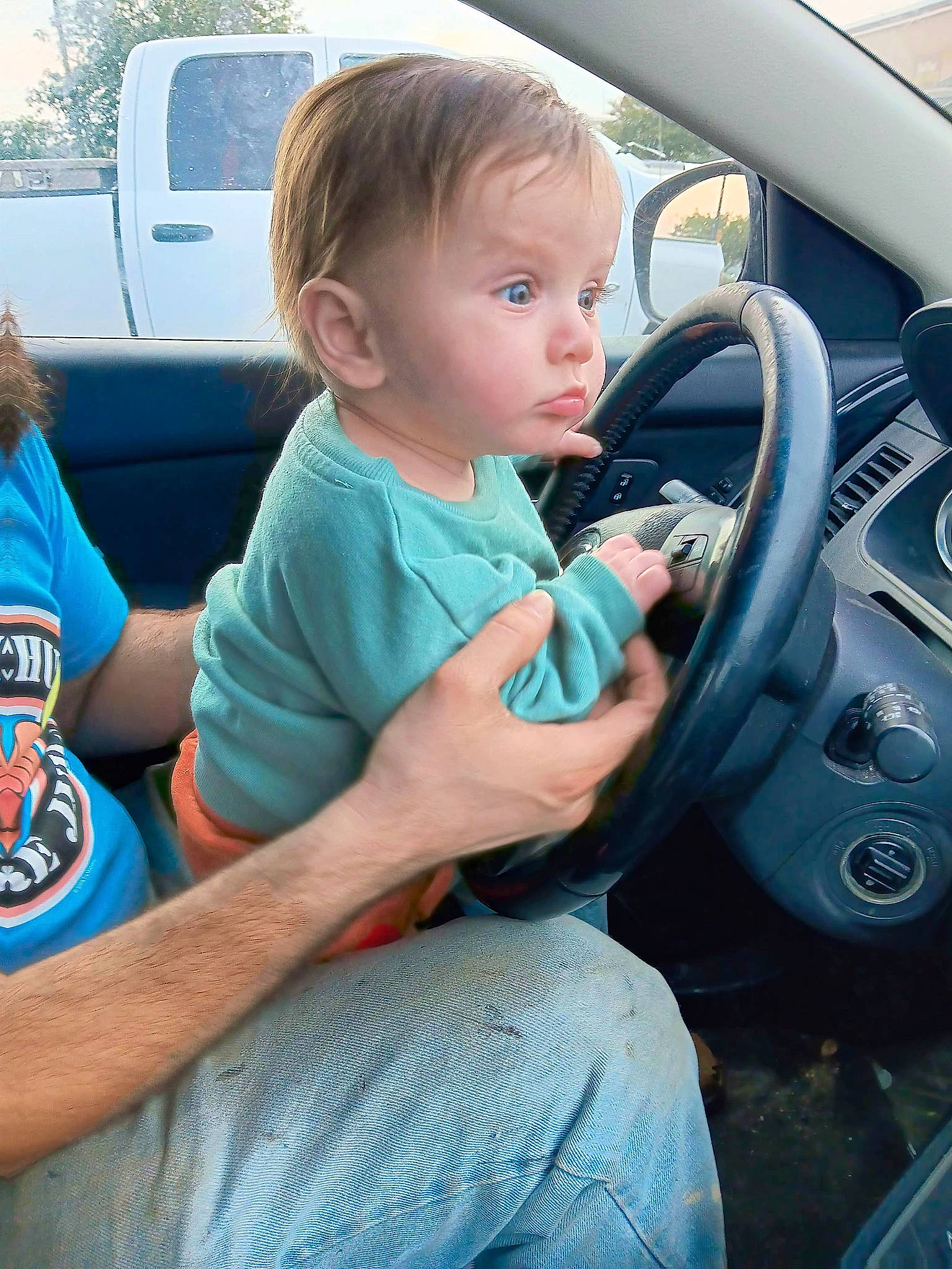 Sasha joined the competition — help win amazing prizes! auto_part, automotive_design, automotive_exterior, automotive_mirror, automotive_tire, automotive_wheel_system, automotive_window_part, car, car_seat, child, family_car, motor_vehicle, person, personal_luxury_car, steering_part, steering_wheel, t_shirt, toddler, vehicle, vehicle_door