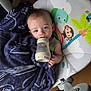 Rowdie joined the competition — help win amazing prizes! baby, blanket, bottle, child, clothing, elephant, face, floor, furniture, indoor, infant, monkey, person, plastic, rainbow, rocker, sleepy, toy, wood, young
