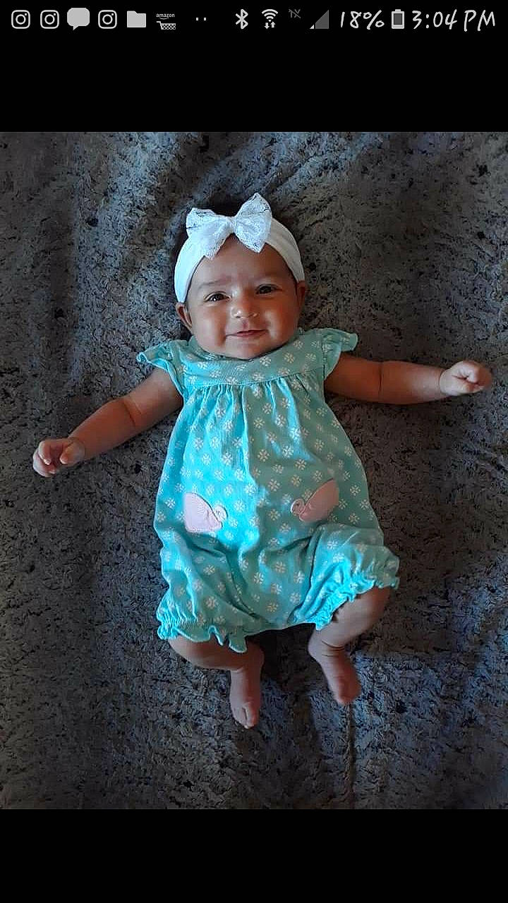 Estrella is registered to the contest to win money with this photo: baby, blue, child, dress, fun, hair_accessory, happy, head, headgear, headwear, joy, person, photography, pink, play, portrait, skin, smile, toddler, turquoise