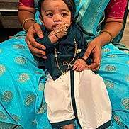 Krishvik joined the competition — help win amazing prizes! baby, bindi, blue, bracelet, child, cultural, cute, foot, gold, hand, holding, indoor, infant, jewelry, lap, person, portrait, ring, saree, traditional_clothing
