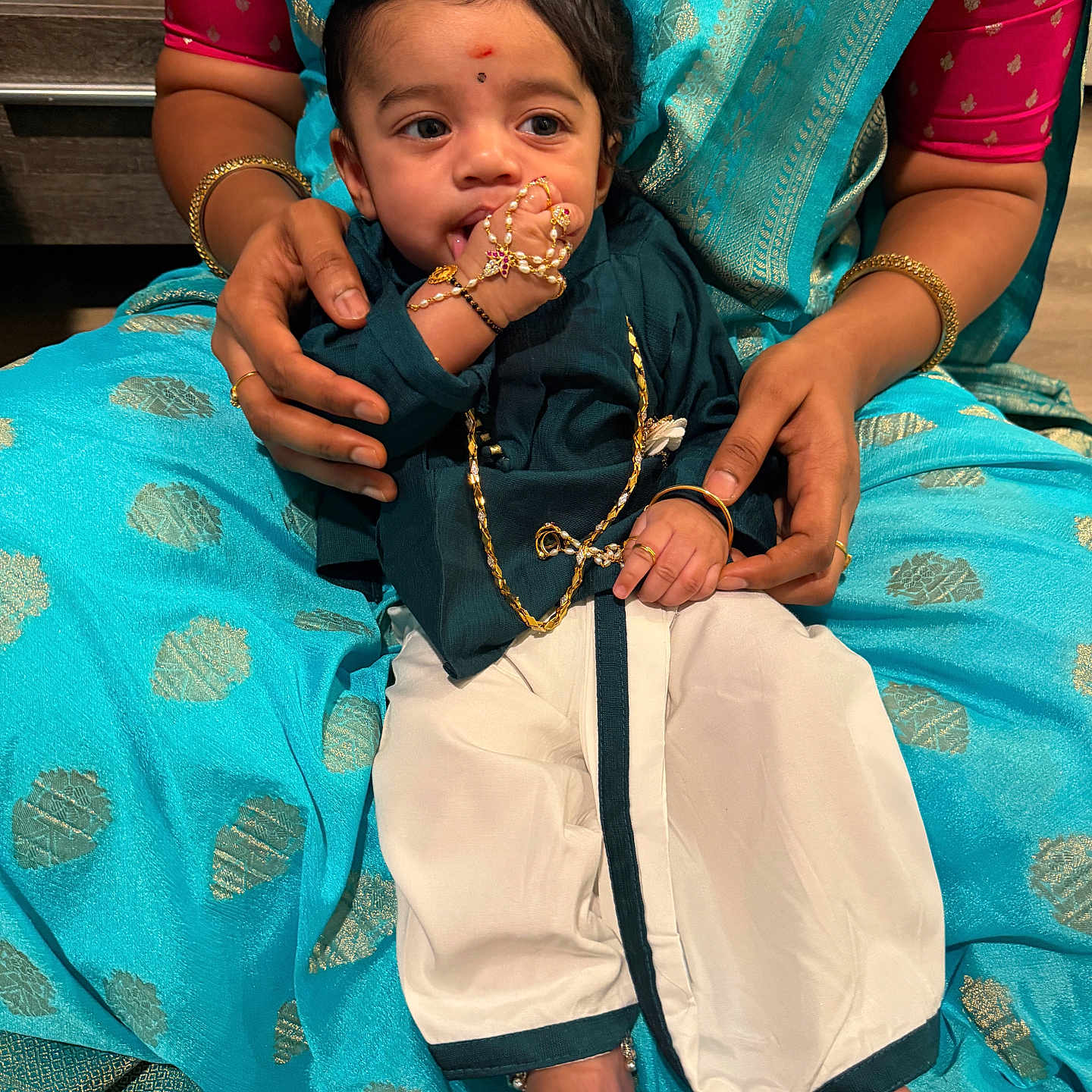 Krishvik joined the competition — help win amazing prizes! baby, bindi, blue, bracelet, child, cultural, cute, foot, gold, hand, holding, indoor, infant, jewelry, lap, person, portrait, ring, saree, traditional_clothing