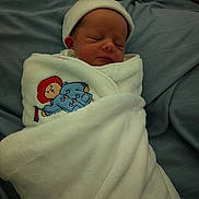 Noah joined the competition — help win amazing prizes! newborn, baby, sleeping, blanket, white_blanket, embroidered_bear, hat, soft_texture, blue_background, cute, peaceful, infant, wrapped, cozy, resting, indoors, portrait, child, sleep, warm