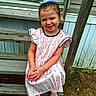 bow, casual, child, cute, dress, footwear, girl, hair, happy, nature, outdoor, person, playful, polka_dot, portrait, sandals, sitting, smile, wooden_steps, young