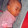 baby, sleeping, infant, portrait, bed, bedding, pink_clothing, peaceful, closed_eyes, face, curled_up, indoors, bedroom, blanket, pillow, heart_sticker, date_text, photography, resting, cute