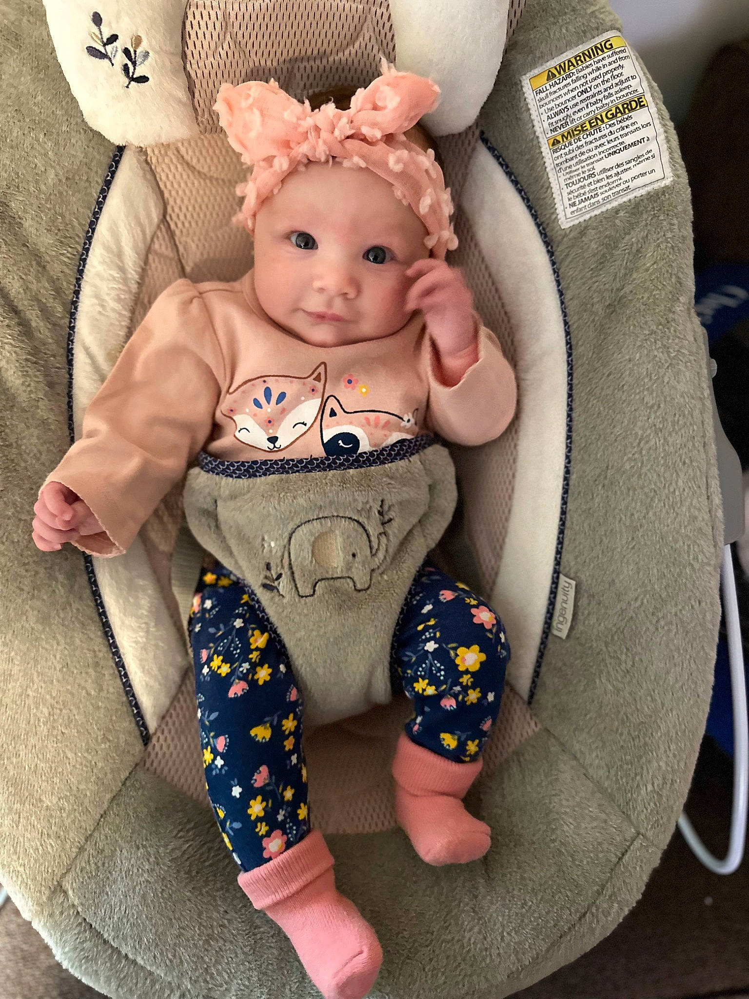 Carley is registered to the contest to win money with this photo: arm, baby, baby_products, baby_toddler_clothing, chair, child, comfort, costume_hat, doll, eyelash, fashion_accessory, finger, head, headwear, jewellery, pattern, person, pink, sitting, sleeve