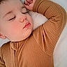 toddler, child, sleeping, face, closed_eyes, brown_clothing, ribbed_fabric, arm, hand, soft_texture, blanket, rest, peaceful, portrait, indoor, cozy, cute, baby, skin, head