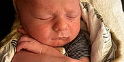 Mylan participe au concours pour gagner de l'argent avec cette photo : newborn, baby, sleeping, blanket, wrapped, hands, peaceful, soft, infant, closeup, skin, portrait, child, resting, cute, cozy, comfort, toddler, person, indoor