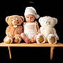 baby, teddy_bear, bench, white_hat, knitwear, plush_toy, child, portrait, studio_photo, black_background, cute, sitting, soft_toy, infant, toy, golden_feet, expression, cozy, childrens_fashion, photography