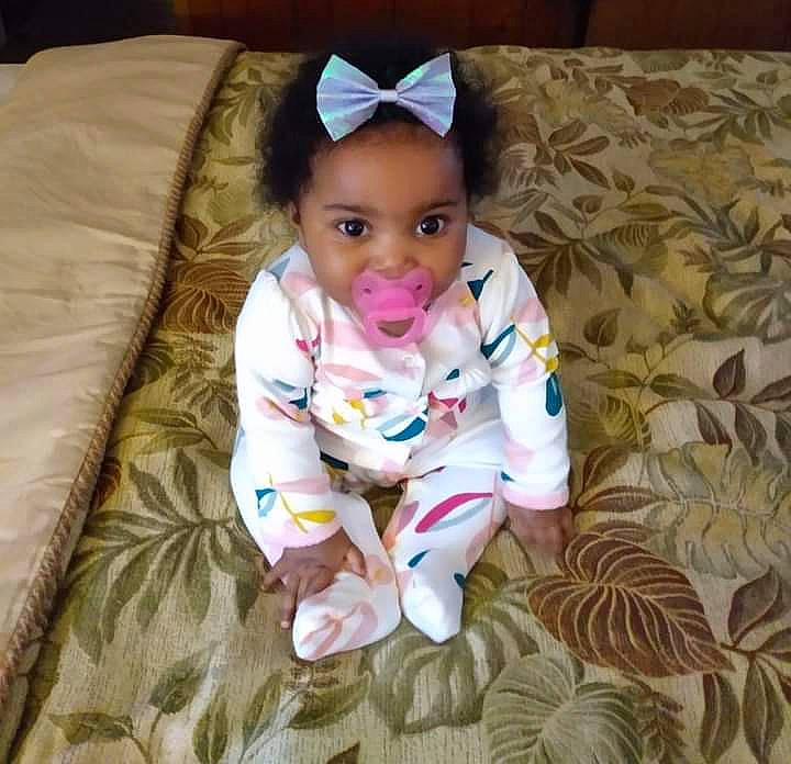 Marie joined the competition — help win amazing prizes! baby, baby_toddler_clothing, cheek, comfort, face, floor, flooring, hand, happy, head, human_body, outerwear, person, product, purple, skin, sleeve, smile, textile, toddler