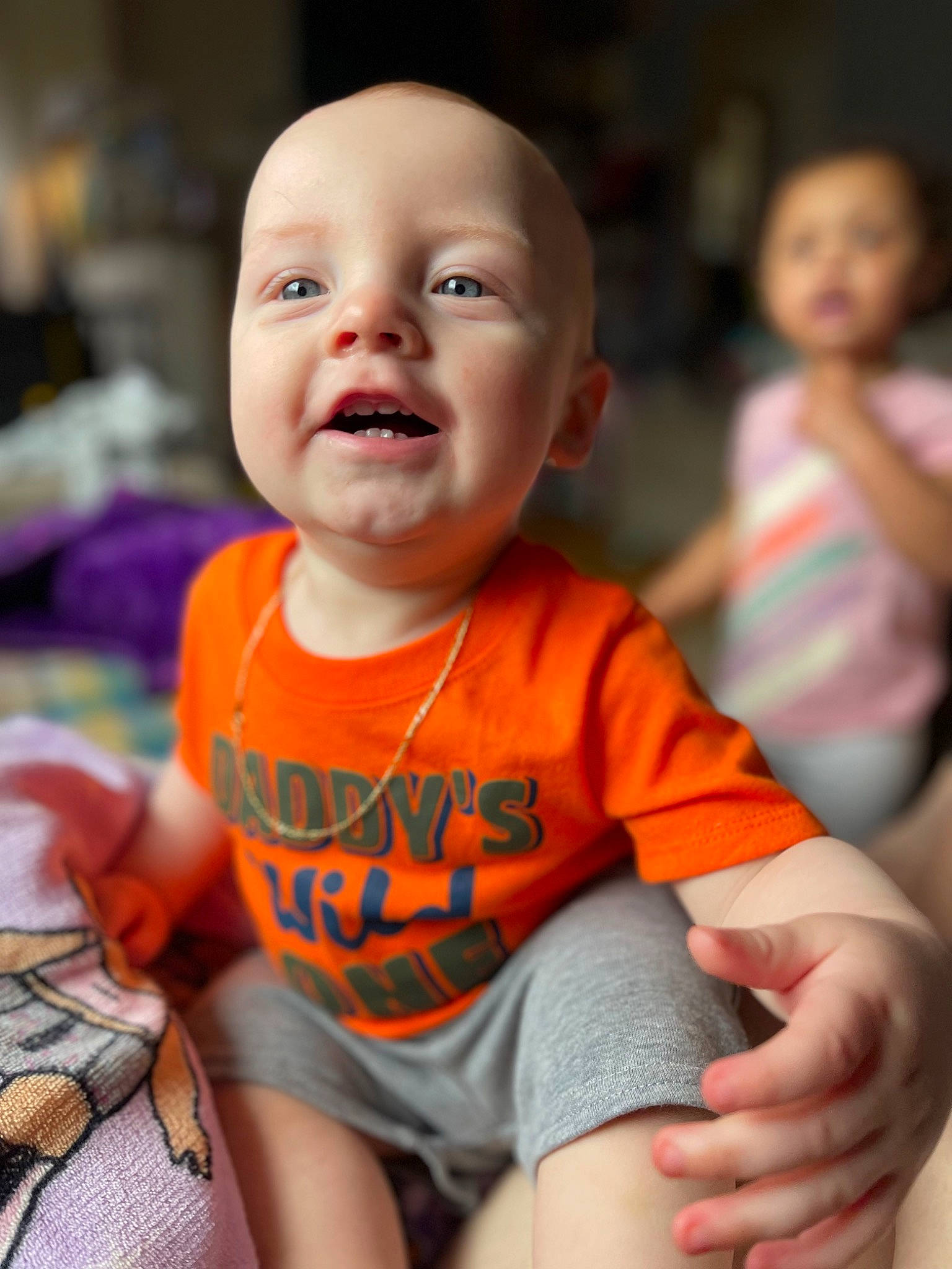 Julian joined the competition — help win amazing prizes! arm, black, blurred, cheek, chin, eye, face, hand, happy, head, human_body, iris, leg, lip, mouth, nose, orange, person, product, shorts