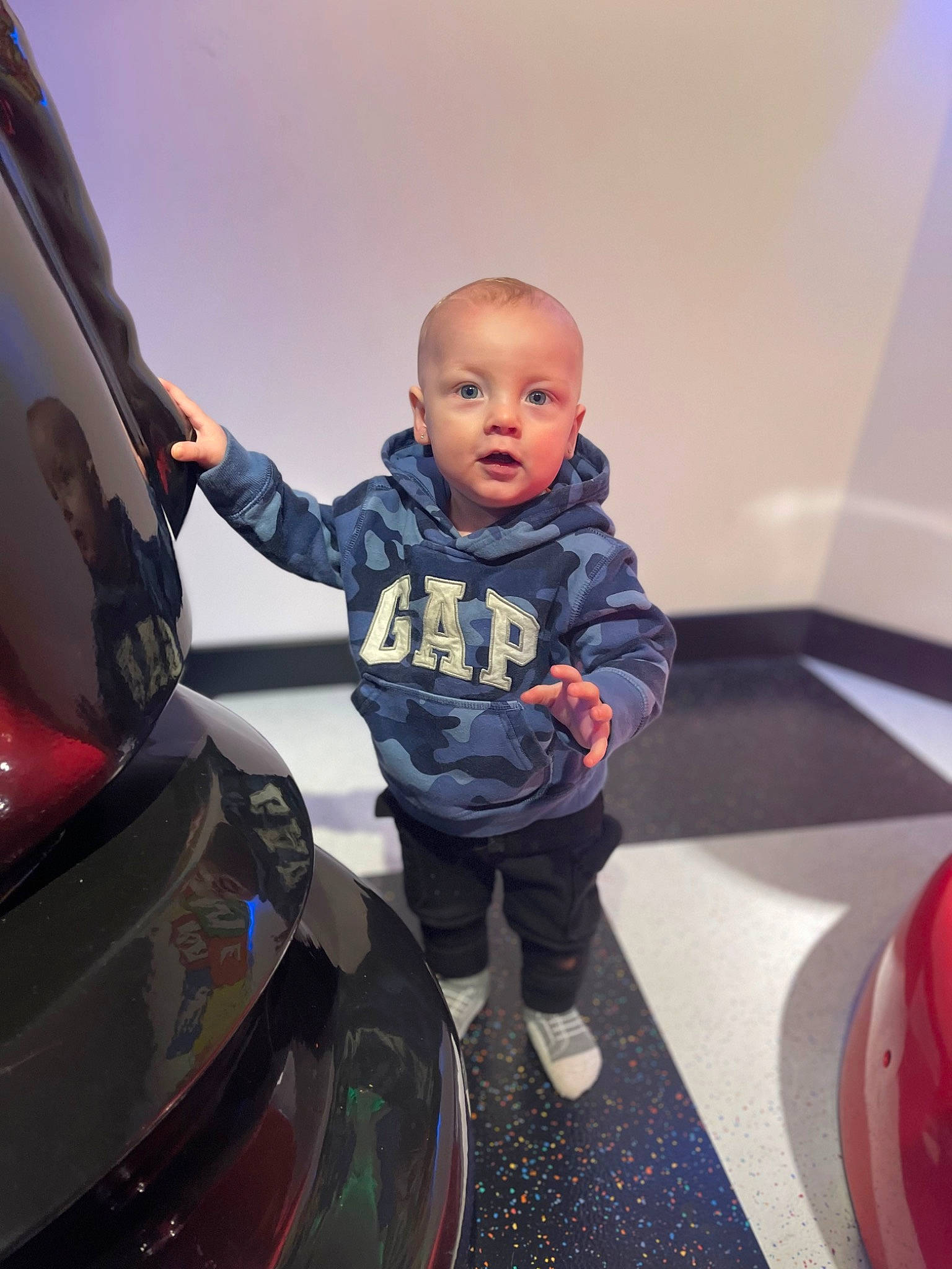Julian joined the competition — help win amazing prizes! automotive_design, automotive_exterior, automotive_lighting, automotive_tail_brake_light, automotive_tire, baby, bumper, car, fender, fun, hood, jacket, jeans, leg, motor_vehicle, person, rim, sneakers, surprise, toddler